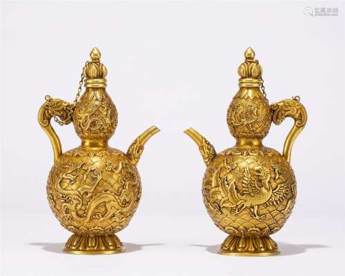 A PAIR OF CHINESE GILT BRONZE DRAGON PATTERN EWERS