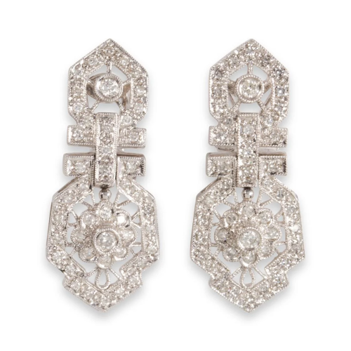 A pair of diamond and fourteen karat white gold earrings