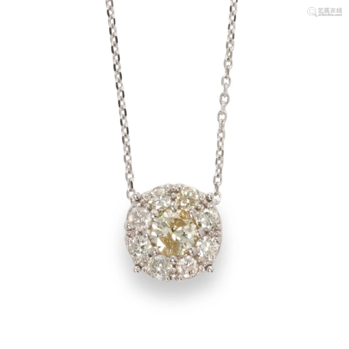 A diamond and fourteen karat white gold pendant necklace