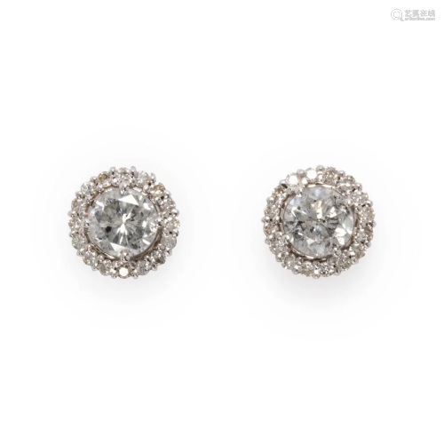 A pair of diamond and eighteen karat white gold stud earring...