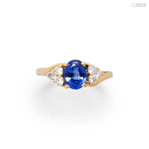 A sapphire, diamond and fourteen karat gold ring