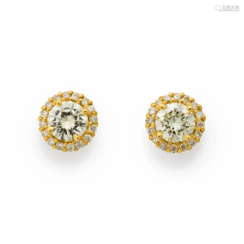 A pair of diamond and eighteen karat gold stud earrings