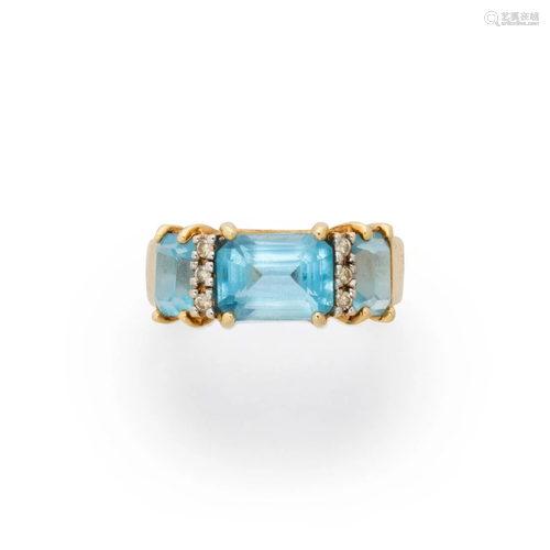 A blue topaz, white sapphires and fourteen karat gold ring