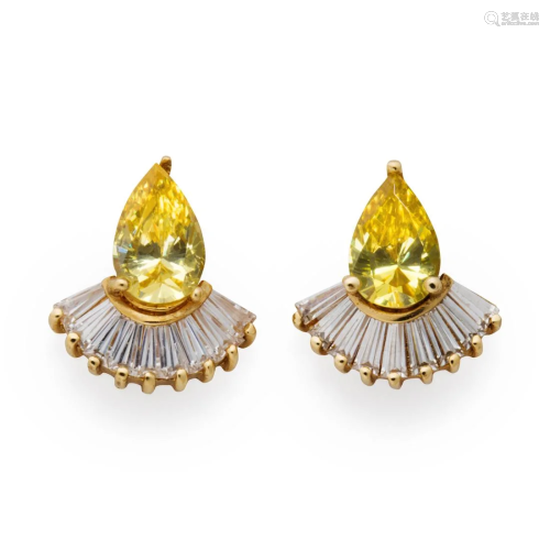 A pair of CZ and fourteen karat gold earrings