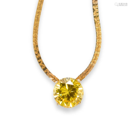 A yellow CZ and fourteen karat gold necklace