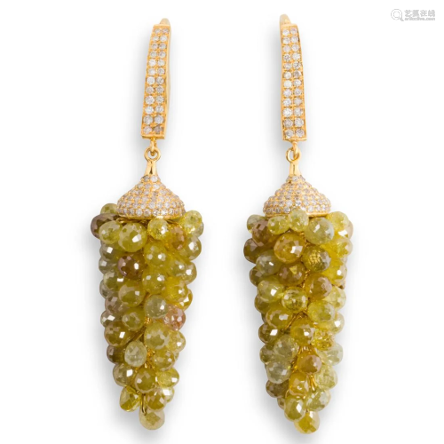 A pair of yellow diamond and eighteen karat gold earrings