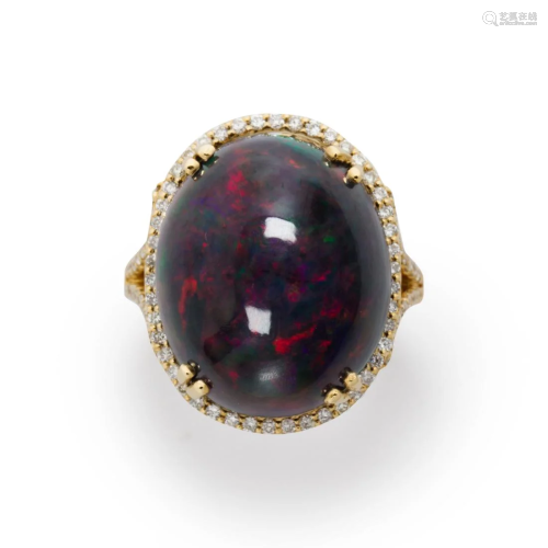 A black opal, diamond and fourteen karat gold ring