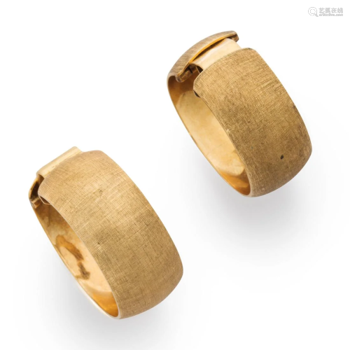 A pair of fourteen karat gold ear cuffs