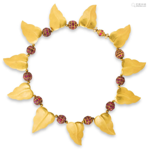 A ruby and twenty-two karat gold necklace
