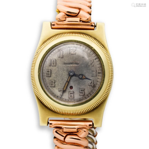A fourteen karat gold wristwatch, Hardwood