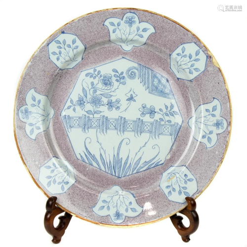 An English Delft Chinoiserie charger with manganese ground