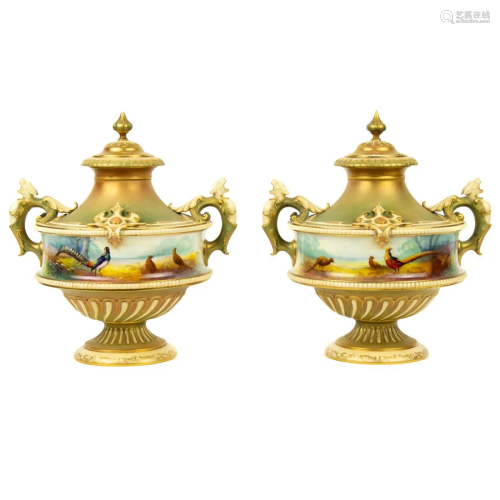A pair of Royal Worcester porcelain covered urns painted by ...