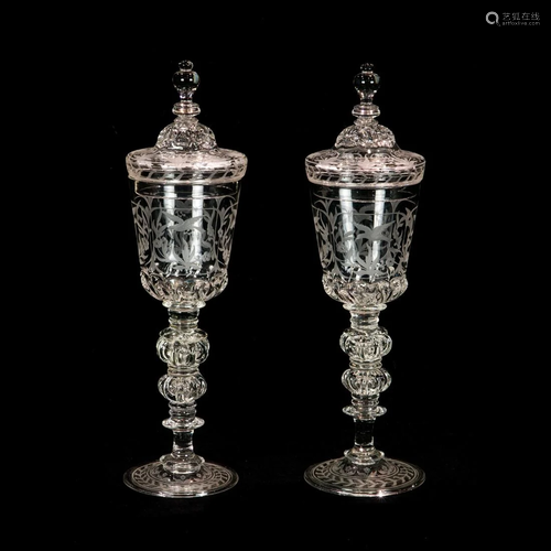 A pair of Lobmeyer engraved glass covered pokals