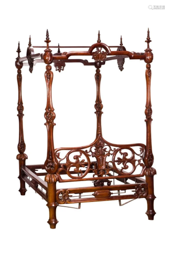 A Rococo Revival carved and pierce decorated full tester bed