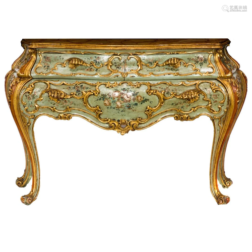 A French polychrome and partial gilt bombe commode in the Lo...