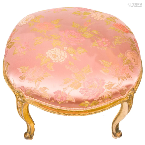 A Louis XV style giltwood carved ottoman