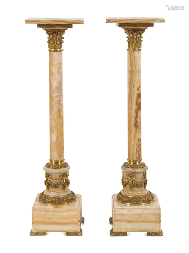 A Pair of French Gilt Bronze Mounted Onyx Pedestals