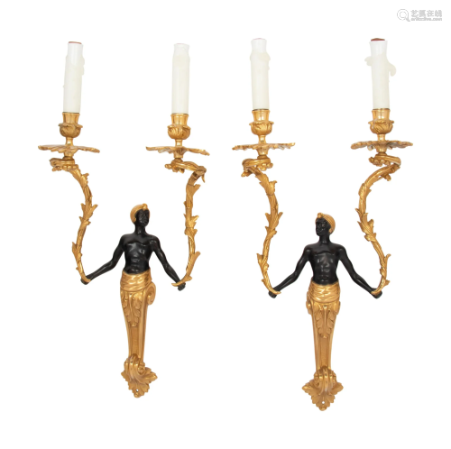A Pair of French Gilt and Patinated Bronze Figural Two-Light...