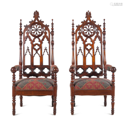 A Pair of Gothic Revival Carved Walnut Armchairs