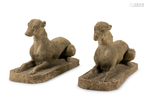 A Pair of Cast Stone Models of Recumbent Dogs