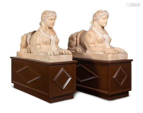 A Pair of Large Composite Marble Sphinxes