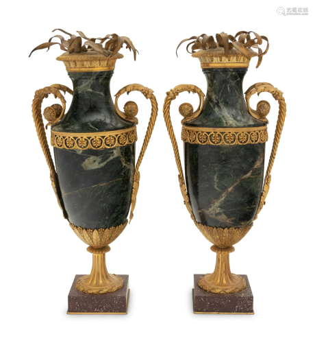 A Pair of Gilt Bronze Mounted Marble Urns on Porphyry Bases