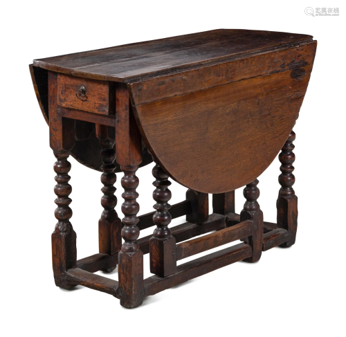 A William and Mary Carved Oak Gate-Leg and Drop-Leaf Table