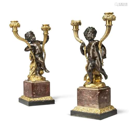 A PAIR OF LOUIS XVI-STYLE BRONZE AND ORMOLU TWO-BRANCH CANDE...