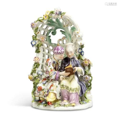 A MEISSEN PORCELAIN GROUP OF A CHINOISERIE COUPLE SEATED IN ...