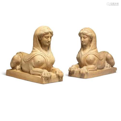 A PAIR OF TERRACOTTA RECUMBENT SPHINXES