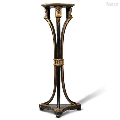 A PARCEL-GILT AND EBONISED TORCHERE