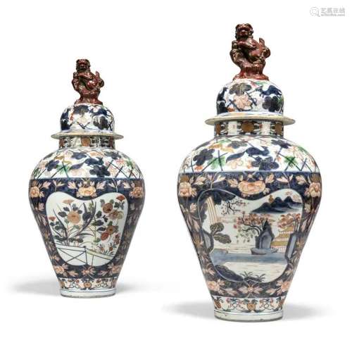A PAIR OF CONTINENTAL FAIENCE IMARI BALUSTER VASES AND COVER...