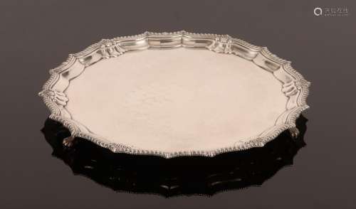 A silver salver, Birmingham 1936, with pie crust border and ...