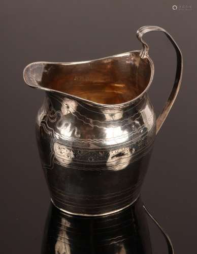 A George III oval silver cream jug, London 1800, with engrav...