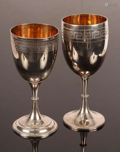 A Victorian silver goblet, London 1874, with engraved border...