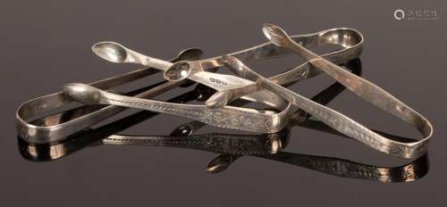 Four pairs of George III silver sugar tongs, one by Samuel G...