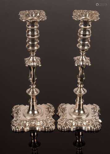 A pair of late Victorian silver candlesticks of 18th Century...