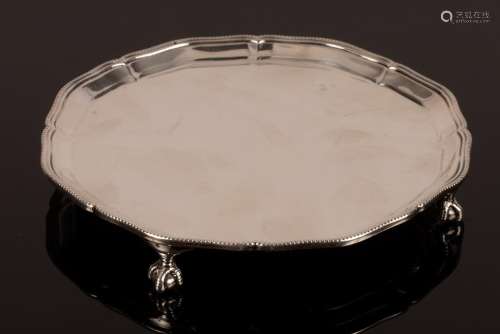 A silver salver, retailed by Harrods, London 1930,