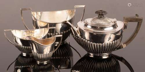 A bachelors silver tea set, the teapot Mackay & Chisolm,...
