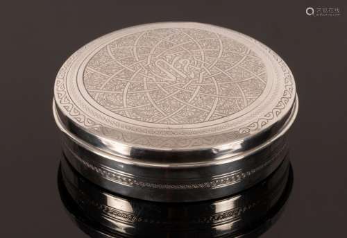 An Egyptian silver circular box with engraved decoration to ...
