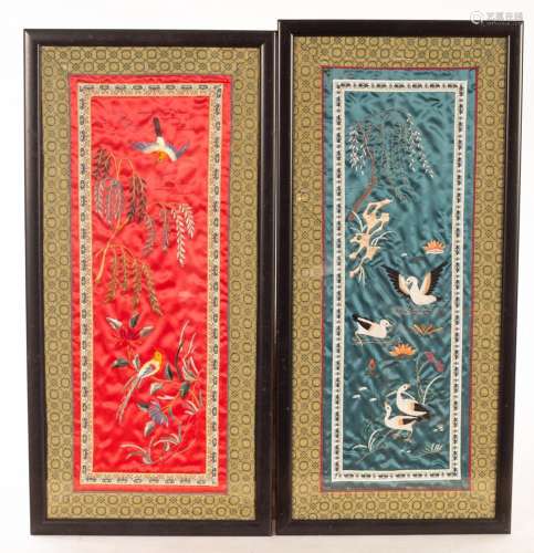 Two framed Chinese embroidered cuffs, one red, one teal, the...