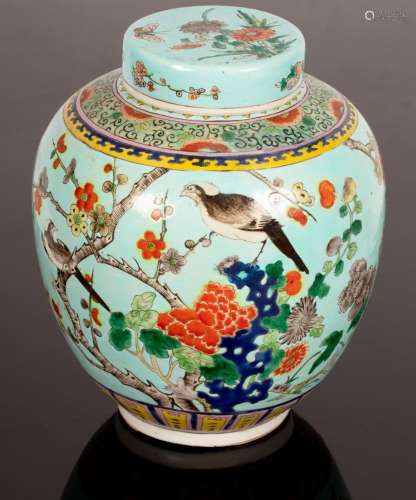 A 20th Century Chinese ginger jar and cover, decorated birds...