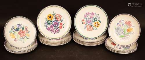 Poole Pottery, twelve floral decorated dinner plates, 25.