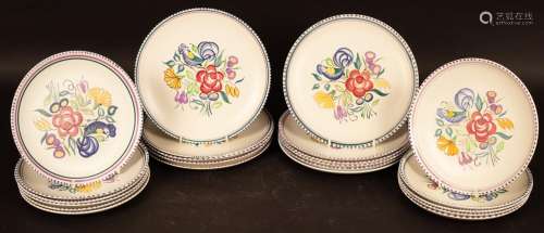 Poole Pottery, thirteen floral decorated dinner plates, 25.