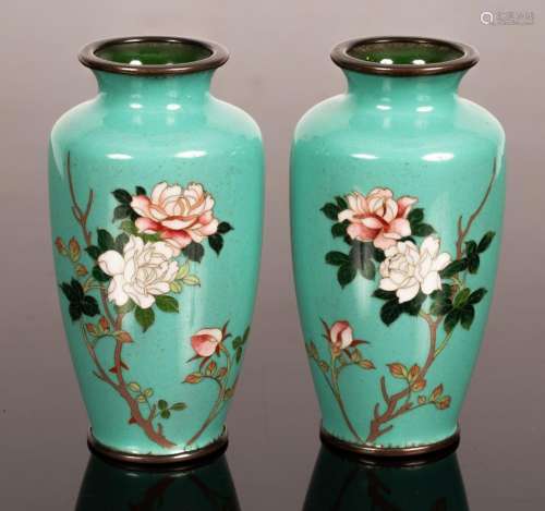 A pair of cloisonne vases decorated flowering peonies on tur...