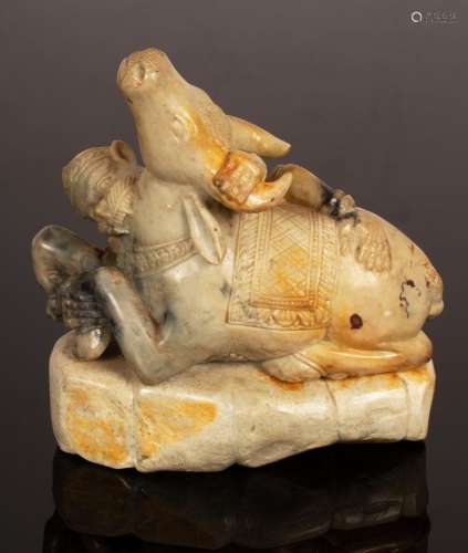 A soapstone figure of a bull being attacked by a monkey, 15c...