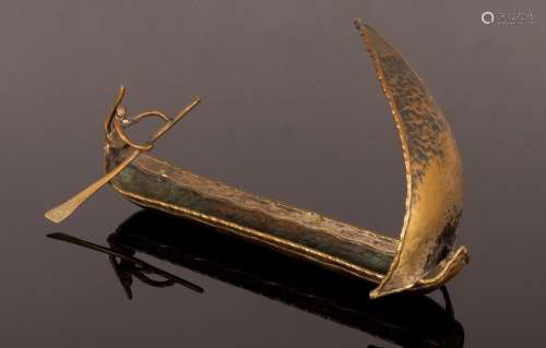 A Loys mixed metal model of a boat with figure, stamped insi...
