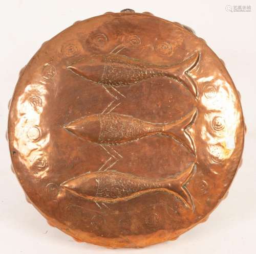 A Newlyn School copper shield embossed three fish,