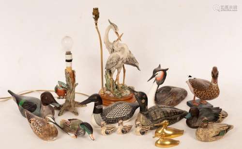 A quantity of carved and painted wooden birds, the largest 3...