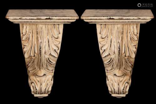A pair of cream painted plaster brackets with acanthus decor...